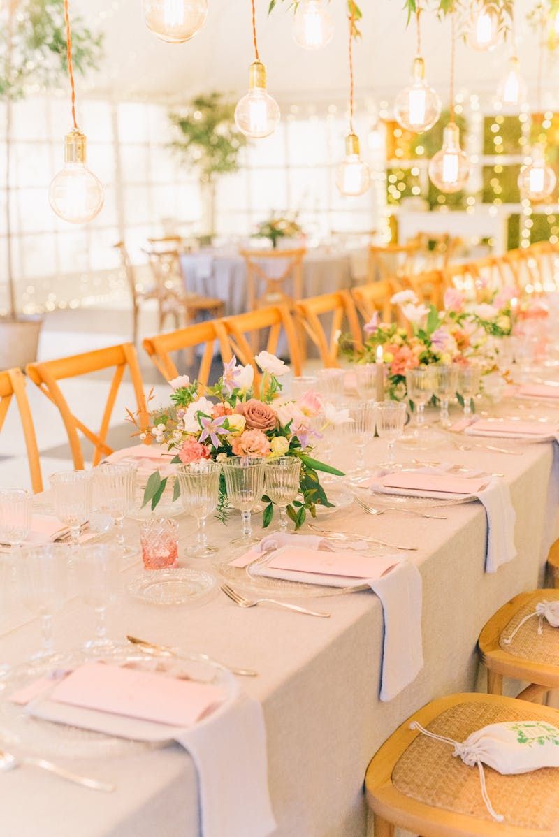 Elegant dinner setting with round tables and warm lighting